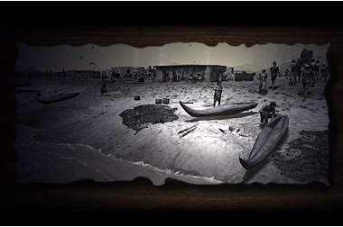 Black and white image of a desert landscape by the shore