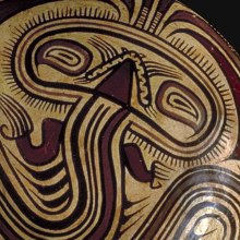 Detailed view of ceramic bowl depicting a serpentine figure - Panama