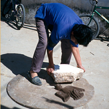 Ceramic Artist using a ceramic mould