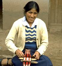 Traditional Weaver using backstrap loom