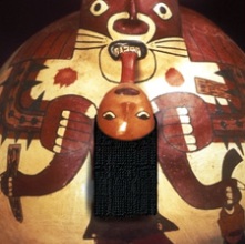 Detailed view of a massive ceramic vessel depicting a trophy head