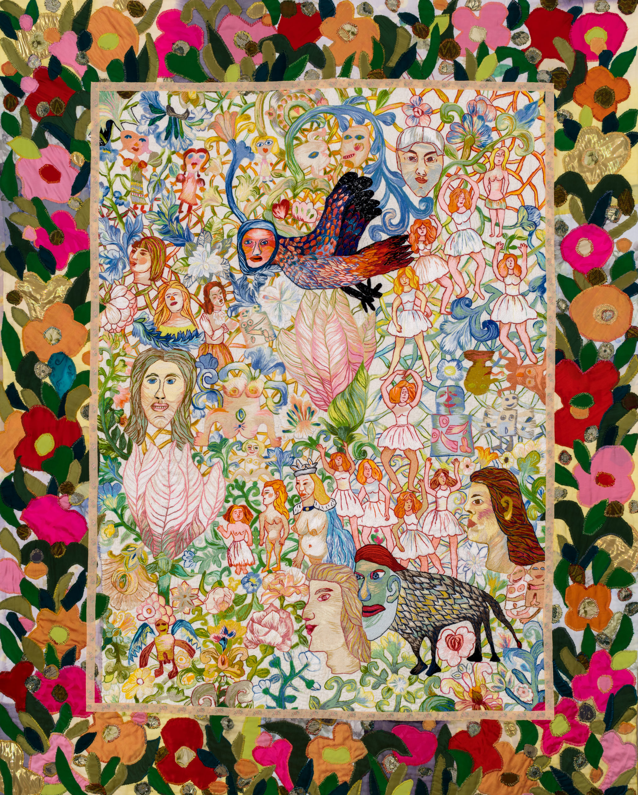 A colourful embroidery by Anna Torma featuring a bird with a human face and other whimsical characters. The main composition is framed by large darker-coloured floral motifs.
