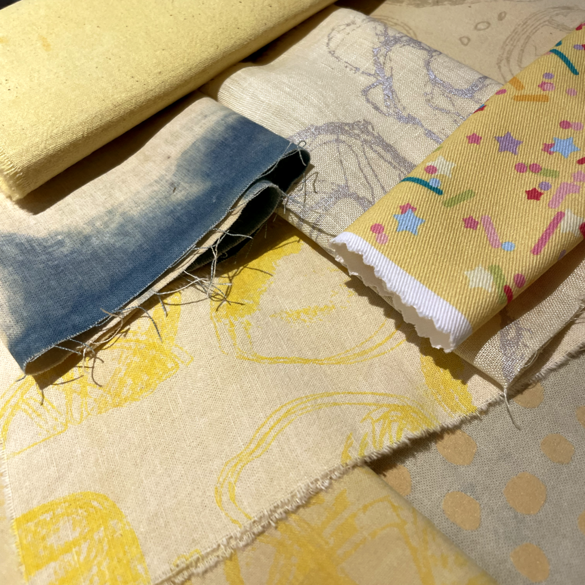 A series of yellow fabrics placed together