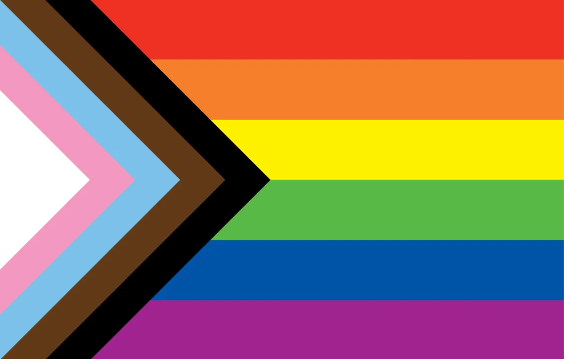 Red, orange, yellow, green, blue, and purple rainbow pride flag with an additional a chevron along the hoist that features black, brown, light blue, pink, and white stripes.
